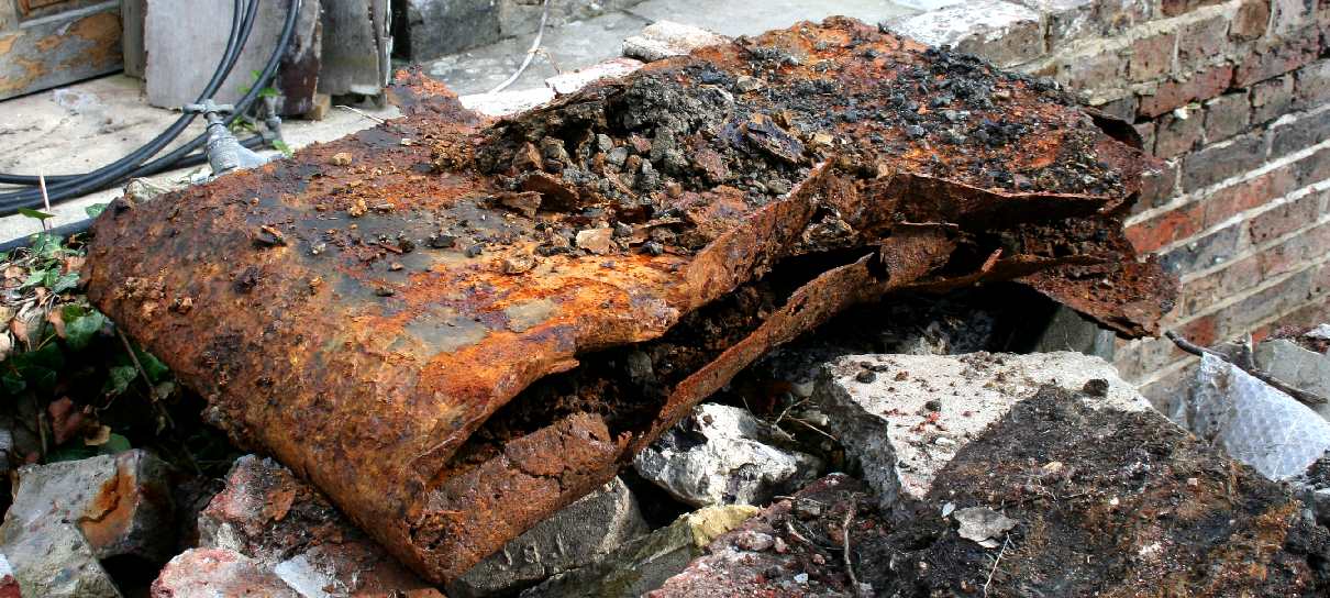 Crushed steel gas cylinder, unearthed in 2016